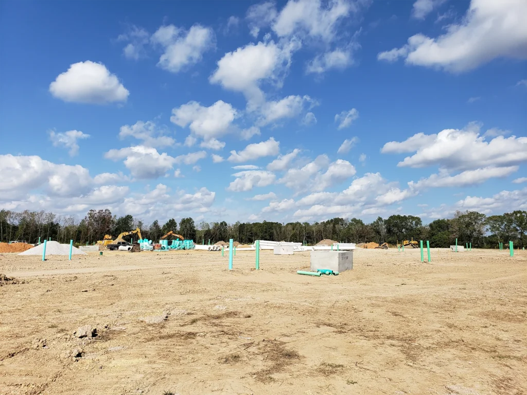excavators-on-field-with-concrete-block