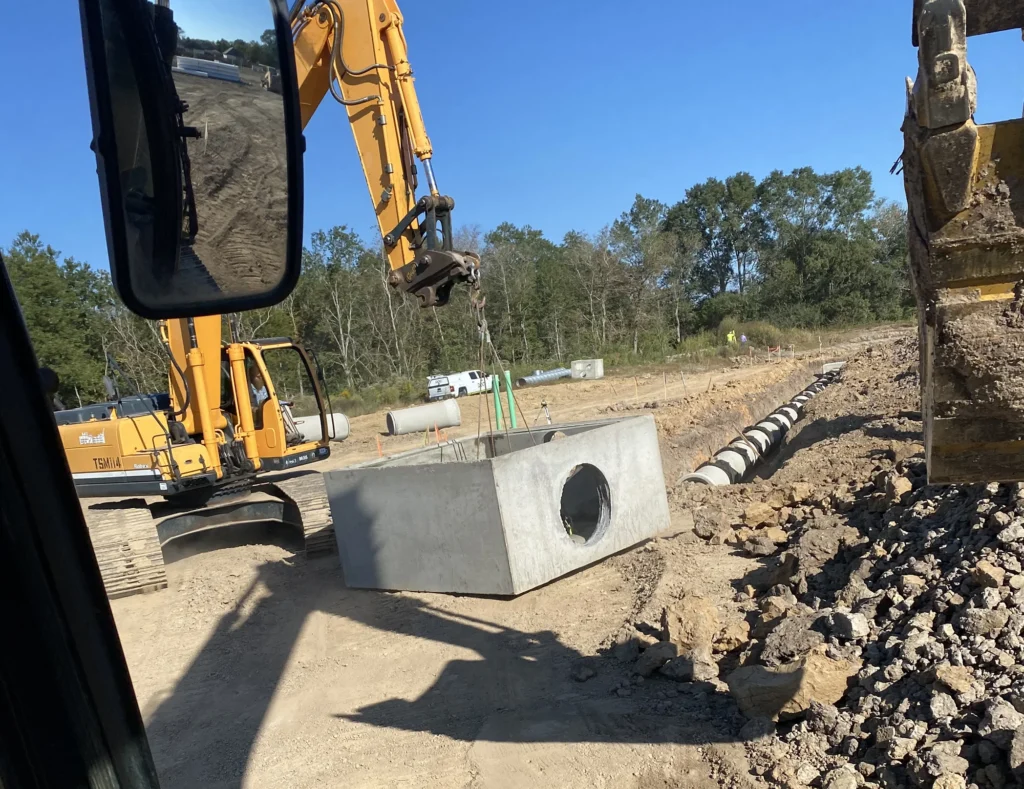 excavator-carrying-concrete-block