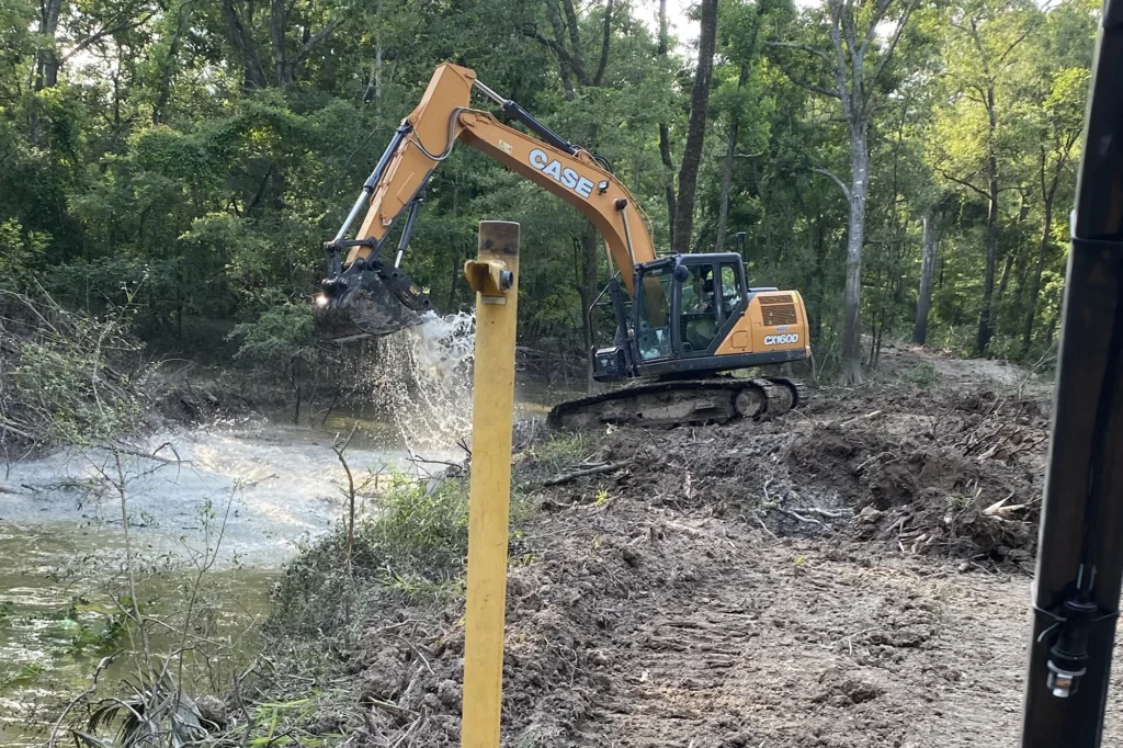 excavator-scooping-water-on-the-creek