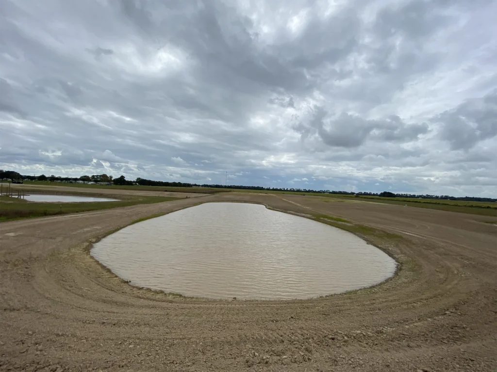 pond-surrounded-by-dirt