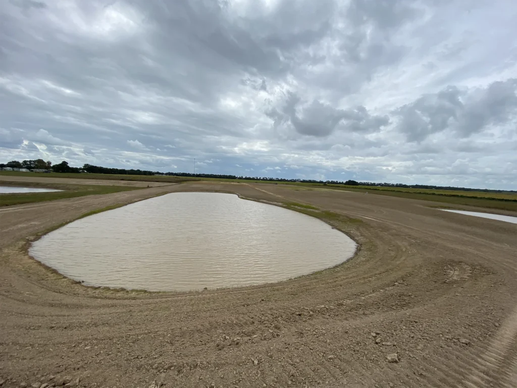 pond-surrounded-by-dirt