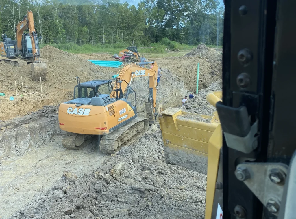 window-view-excavator-digging-straight