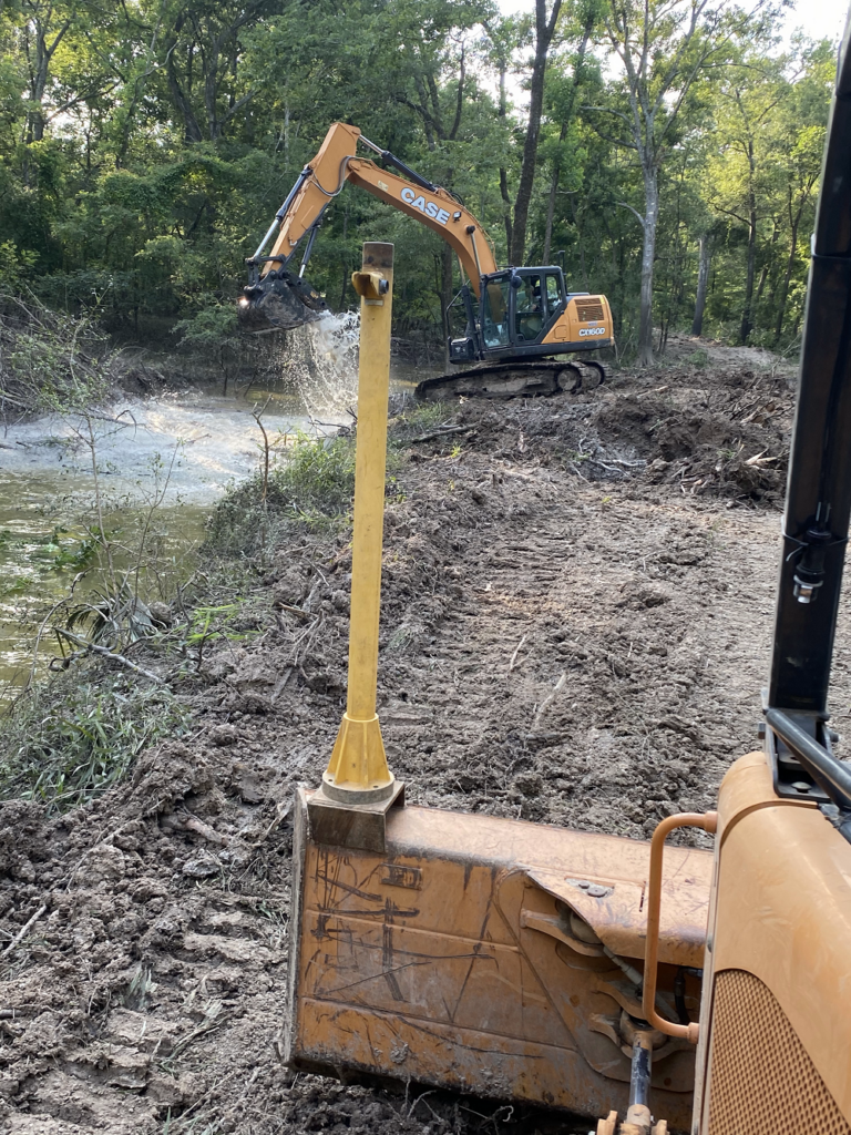 excavator-scooping-water-on-the-creek