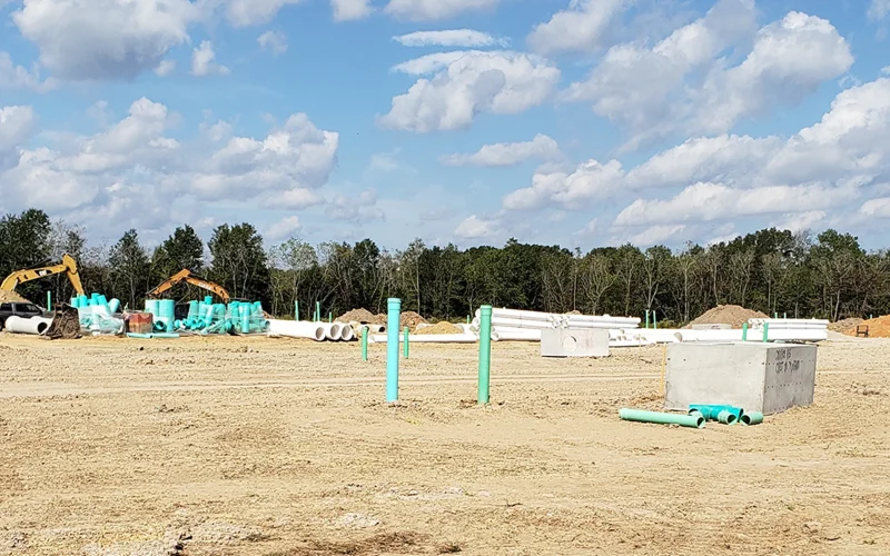 excavators-on-field-with-concrete-block