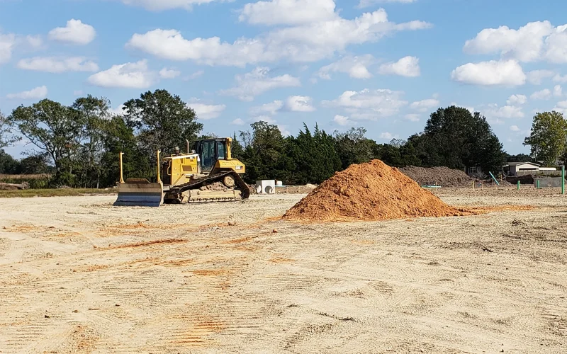 excavators-on-field-with-soil